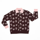Brown cardigan with pink floral pattern, a buttoned up front and pink collar on a white background