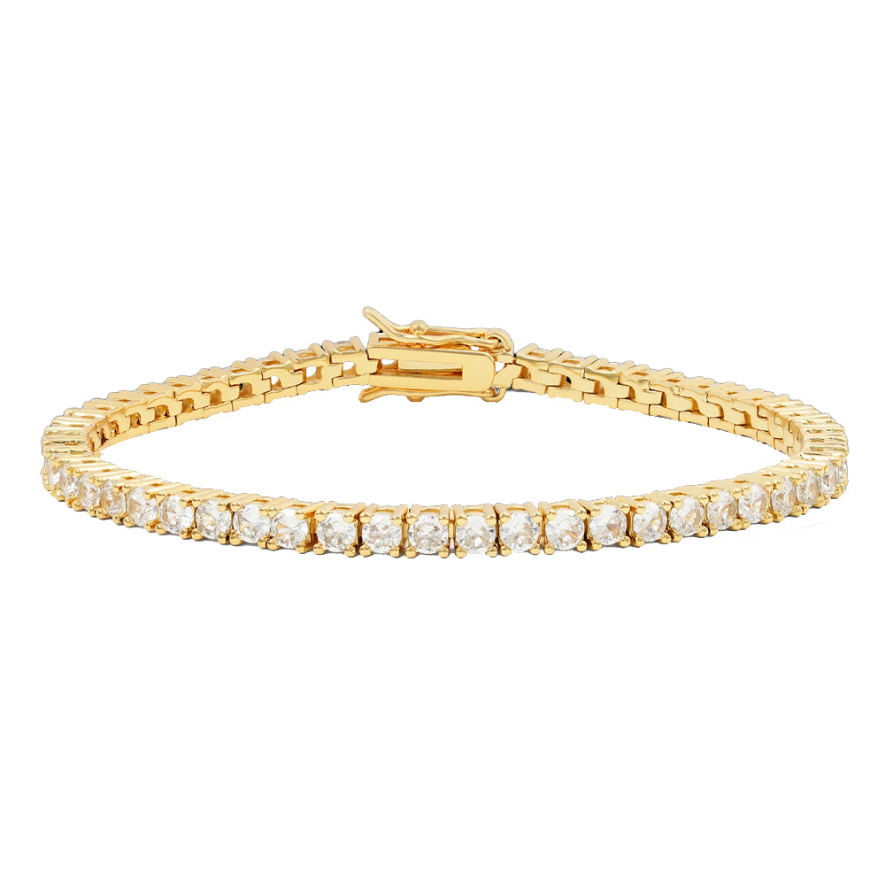 Gold bracelet with clear stones on a white background