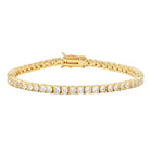 Gold bracelet with clear stones on a white background