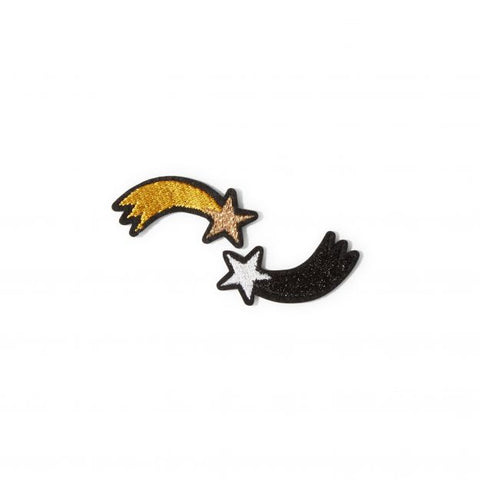 A set of two embroidered shooting star patches in gold and monochrome.