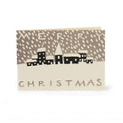 An image of a small Christmas Card showing a print of a small town covered in snow with the message 'Merry Christmas'