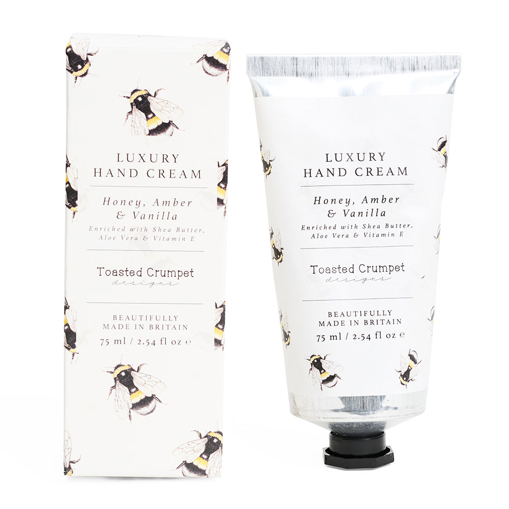Luxury hand cream packaging with bee design on a white background
