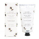 Luxury hand cream packaging with bee design on a white background