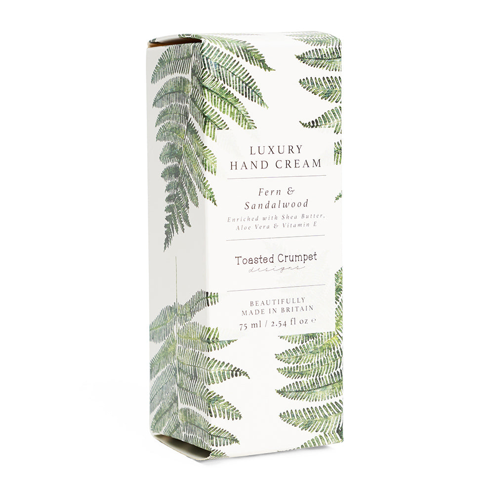 Box of luxury hand cream with fern design on a white background