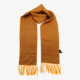 A yellow scarf with tassels.