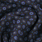 Close-up of patterned fabric with blue and purple floral design 