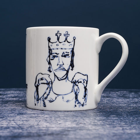 White ceramic mug with dark blue ink design of a woman in a crown.