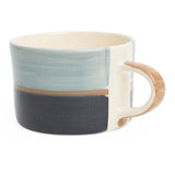 Three toned mug in light blue, dark blue and sand. 