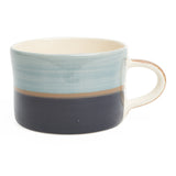 Three toned mug in light blue, dark blue and sand. 