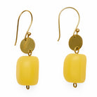 Yellow charm earrings with gold hooks on a white background