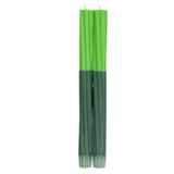 A pair of green two-tone twisted candles