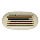 Oval enamel tray with vintage pencil design against a white background.