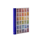 Colour swatch design book with grids of colour and a blue spine on a white background