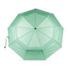 A mint green compact umbrella shown open from a top-down view on a clean white background.