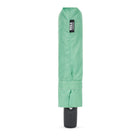 A mint green folded umbrella cover with a black ROKA brand label, shown vertically on a plain white background.