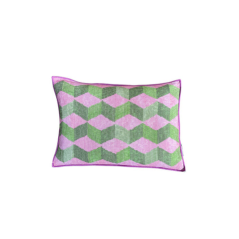 Front of rectangular cushion in a green and pink geometric pattern. 