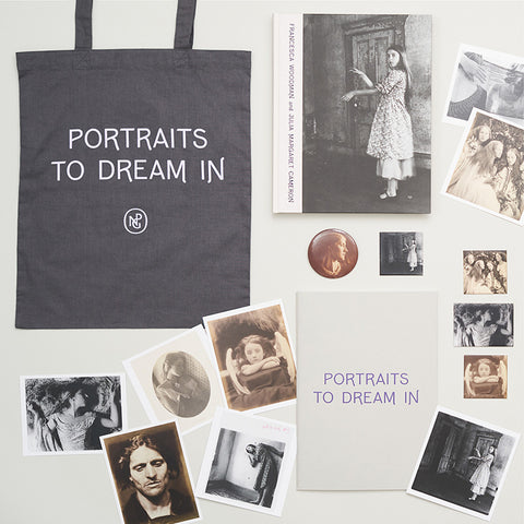 Styled photograph with Portraits to Dream in tote bag, sketchbook and photographic postcards. 