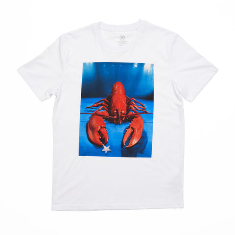 White t-shirt featuring Yevonde's photograph of a red lobster holding a star against a blue background in the centre. 