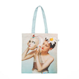 Tote bag featuring Yevonde's photograph of Rosemary Chance holding a mask.