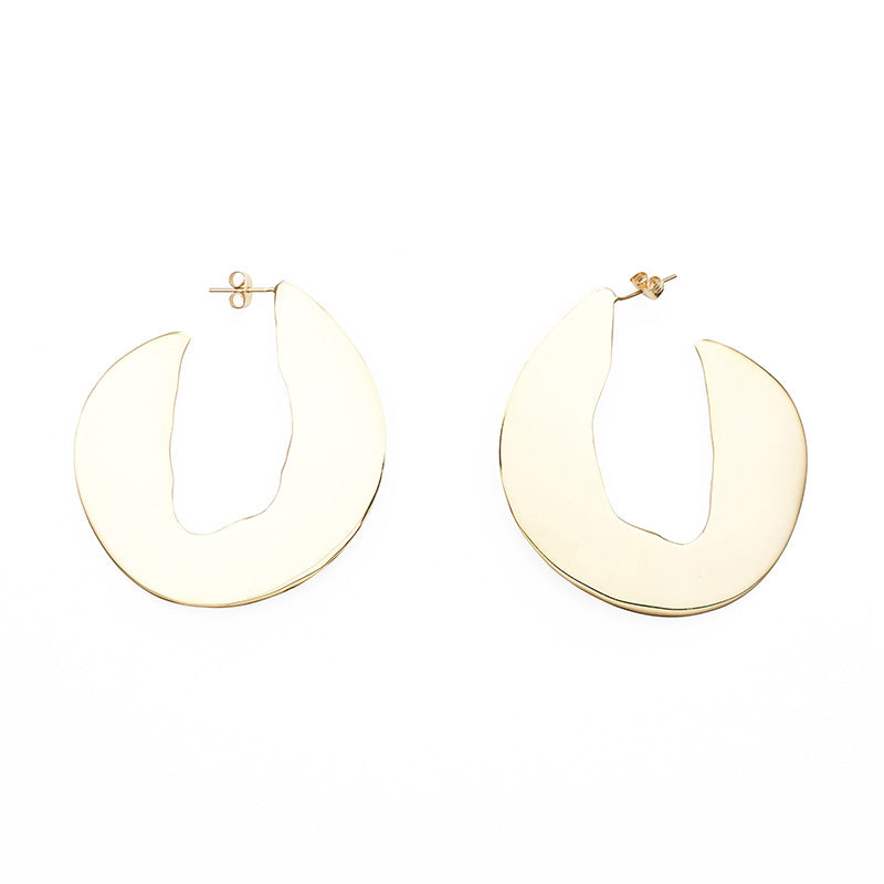 A pair of large rounded hook shaped stud earrings in gold 