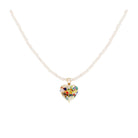 A small multicoloured glass heart pendant on a chain made of small pearls.