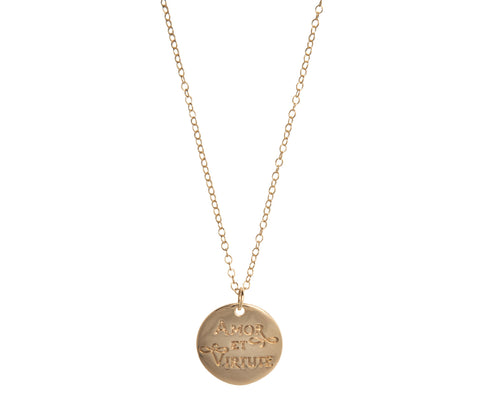 Gold chain with 'Amor et Virtute' written on a gold pendant
