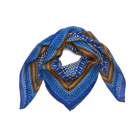 Multicoloured blue, brown and white motif scarf wrapped in a circle.