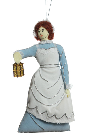 Handmade fabric sewn decoration featuring Florence Nightingale in a blue dress with white overall holding a lantern.