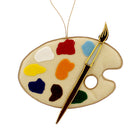 Handmade fabric sewn artist's palette decoration featuring paints and paintbrush.