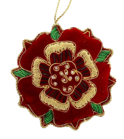 A handmade fabric sewn decoration featuring the Tudor Rose in red velvet with gold embroidery.
