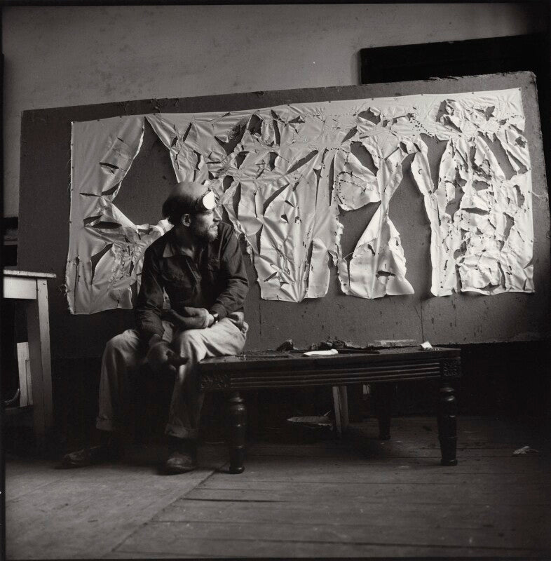 Gustav metzger practicing for a public demonstration of auto destructive art using acid on nylon npg x134798