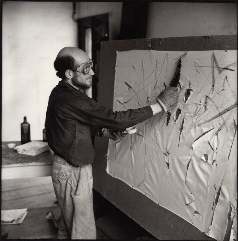 Gustav metzger practicing for a public demonstration of auto destructive art using acid on nylon npg x134796