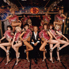 Paul Raymond and twelve dancers including Ella; Charlotte; Linda Valentine and Fiona Wilde NPG x134392