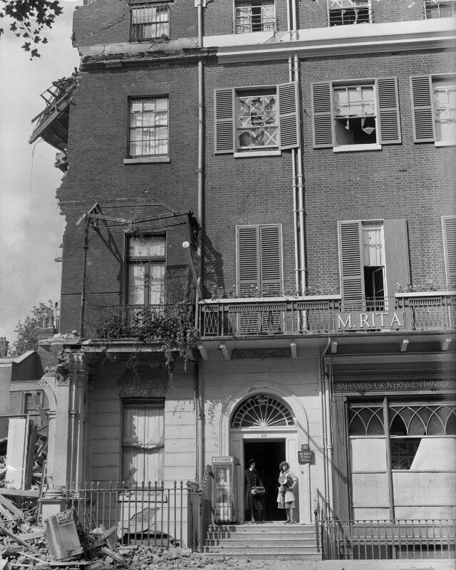 Bomb damage, berkeley square, london, showing yevonde and an assistant in the doorway, with retrieved day books and lights npg x223753