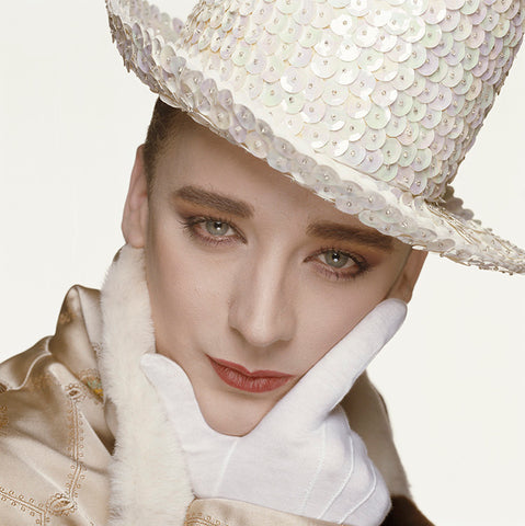 Colour photograph of Boy George wearing a sequin hat taken by Terry O'Neill.