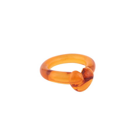 A yellow amber glass heart shaped ring.