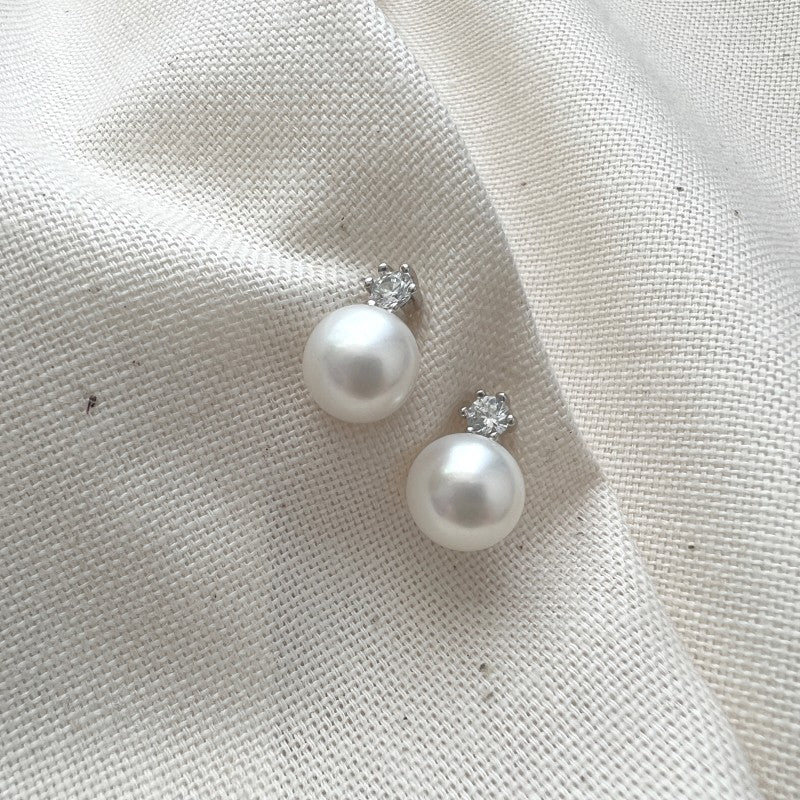 Pearl and cubic zirconia stud earrings inspired by Her Majesty the Queen's favourite earrings. Specially for the Platinum Jubilee collection at the National Portrait Gallery online shop