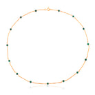 Venus extra slim gold necklace with green malachite balls.